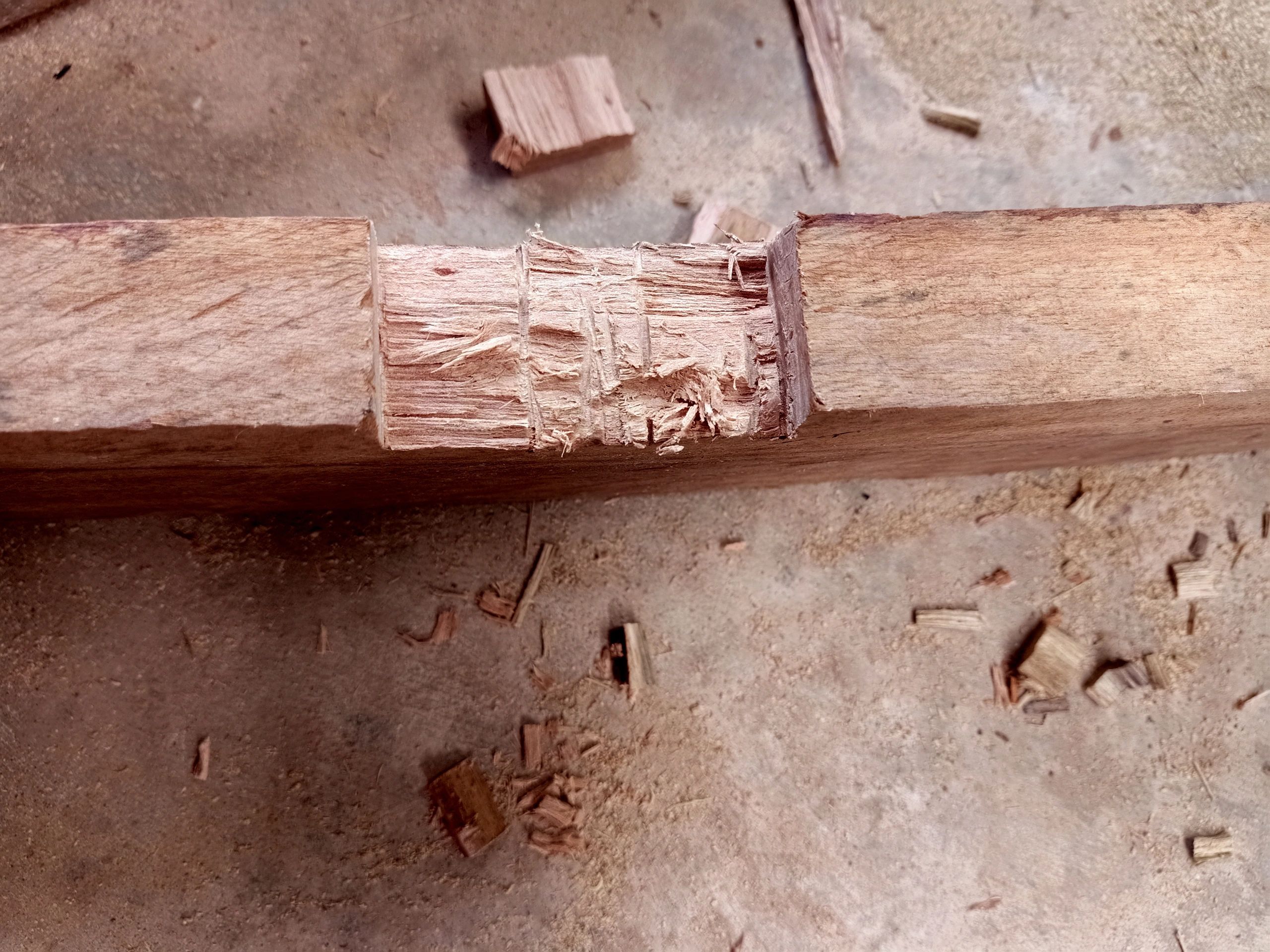 Carpenter working on wood joinery in a workshop